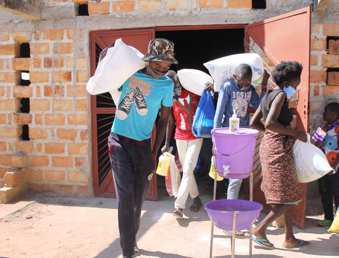 FVI-Covid-19-Relief-Efforts Fisenge beneficiaries with the food hampers