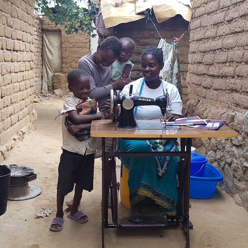 beneficiary carrying food hamper