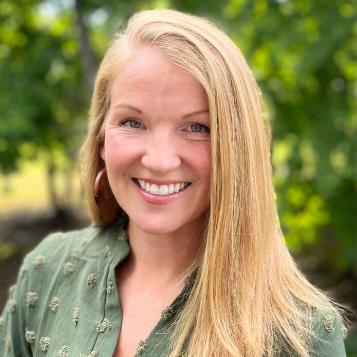 Forgotten Voices International - Professional headshot of woman smiling.