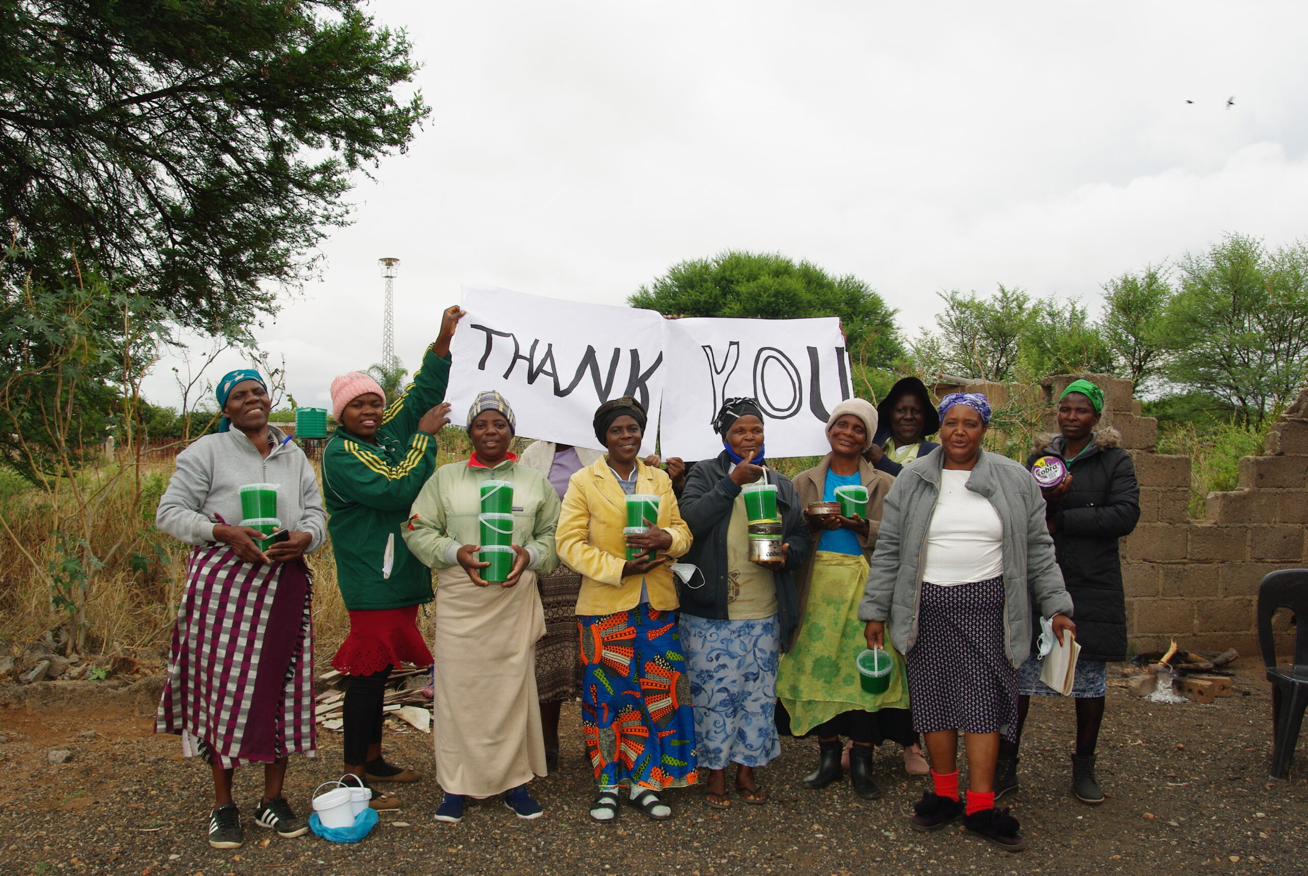 Caregivers in southern Africa with their detergent-making business inventory.