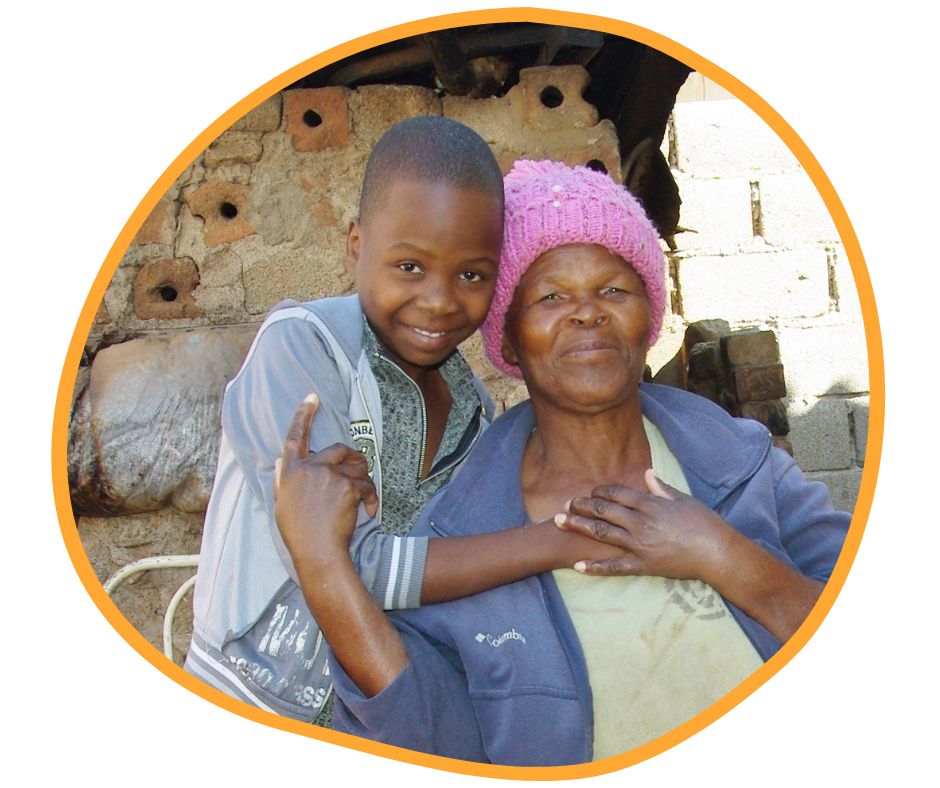 A grandmother gets a hug from her granddaughter.